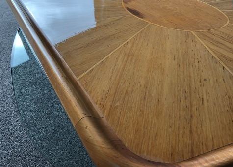 Optically clear paint protection film applied to saloon table